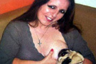 Woman Breastfeeds Dog To ’Feel Complete motherhood